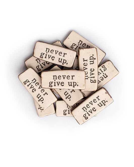 Never give up. Ceramic Pocket Rock Reminders